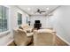 Spacious living room bathed in natural light features wood floors, neutral walls, and a comfortable seating area at 86 Stratford Nw Dr, Atlanta, GA 30311