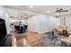Open concept living room with a view of the dining room and kitchen featuring hardwood floors at 86 Stratford Nw Dr, Atlanta, GA 30311