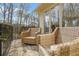 Relaxing balcony with outdoor seating offering views of the surrounding wooded landscape at 1500 Historic Vw, Stone Mountain, GA 30087