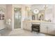 Well-lit bathroom featuring a double vanity, walk-in shower, and charming wallpaper at 1500 Historic Vw, Stone Mountain, GA 30087