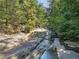 Creek flowing between rock formations and trees at 1500 Historic Vw, Stone Mountain, GA 30087