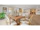 Open concept dining room and living area with a large wooden table and comfortable seating at 1500 Historic Vw, Stone Mountain, GA 30087