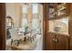 Light-filled dining room with glass table and detailed decor, adjacent to butler's pantry at 1500 Historic Vw, Stone Mountain, GA 30087