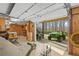 Oversized garage featuring a tractor, covered boat, and roll-up door to outdoor living space at 1500 Historic Vw, Stone Mountain, GA 30087