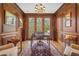 Sophisticated home office with wood paneling, built-ins, and large windows at 1500 Historic Vw, Stone Mountain, GA 30087