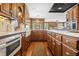 Spacious kitchen with wood cabinets, marble countertops, and a white farmhouse sink at 1500 Historic Vw, Stone Mountain, GA 30087