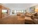 Spacious living room with carpet flooring, built-in entertainment center, and ample seating at 1500 Historic Vw, Stone Mountain, GA 30087
