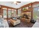 Cozy living room with stone fireplace, plush seating, and natural light at 1500 Historic Vw, Stone Mountain, GA 30087