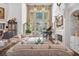 Elegant living room with grand piano, high ceilings, and walls of windows overlooking the backyard at 1500 Historic Vw, Stone Mountain, GA 30087