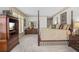 Spacious main bedroom suite with four-poster bed and hardwood furnishings at 1500 Historic Vw, Stone Mountain, GA 30087