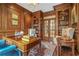 Elegant wood paneled office with built-in bookshelves and French doors, perfect for working from home at 1500 Historic Vw, Stone Mountain, GA 30087