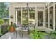 Charming outdoor patio with elegant furniture, lush greenery, and a view of the backyard at 1500 Historic Vw, Stone Mountain, GA 30087