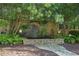 Picturesque stone pond and waterfall feature surrounded by lush greenery and trees at 1500 Historic Vw, Stone Mountain, GA 30087