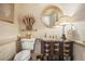 Elegant powder room with unique vanity, decorative mirror, and stylish wallpaper at 1500 Historic Vw, Stone Mountain, GA 30087