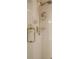 Close up of a tiled shower with gold fixtures at 1500 Historic Vw, Stone Mountain, GA 30087