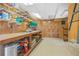 Wood-paneled workshop complete with shelving, storage, and a workbench for various projects at 1500 Historic Vw, Stone Mountain, GA 30087