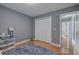 ' bedroom with hardwood floors, closet, and neutral gray paint at 20 Friendship Rd, Euharlee, GA 30145