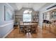This dining room has wood floors, an arched window, chandelier and a hutch with glass doors at 20 Friendship Rd, Euharlee, GA 30145