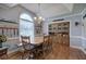 Dining room features hardwood floors, a large arched window, chandelier and a wooden hutch at 20 Friendship Rd, Euharlee, GA 30145