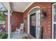 Charming front porch with a rocking chair and lovely decor, creating a cozy entrance at 20 Friendship Rd, Euharlee, GA 30145