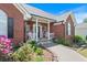 Inviting brick home with a cozy front porch, beautiful landscaping, and a welcoming entrance at 20 Friendship Rd, Euharlee, GA 30145