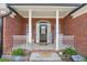 Charming front porch with rocking chairs and lovely decor, creating a cozy and inviting entrance at 20 Friendship Rd, Euharlee, GA 30145