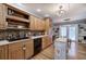 This is a kitchen with wooden cabinets, an island, stainless steel appliances and hardwood floors at 20 Friendship Rd, Euharlee, GA 30145