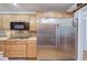 Kitchen featuring stainless steel refrigerator, wooden cabinets, and stainless steel microwave at 20 Friendship Rd, Euharlee, GA 30145