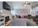 Comfortable living room featuring a fireplace, vaulted ceilings, hardwood floors, and a ceiling fan at 20 Friendship Rd, Euharlee, GA 30145
