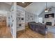 Open living space with a vaulted ceiling, hardwood floors, fireplace, and shelving at 20 Friendship Rd, Euharlee, GA 30145