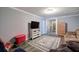 Spacious living room with laminate flooring, cozy couches, and a large television at 20 Friendship Rd, Euharlee, GA 30145