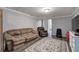 Comfortable living room featuring plush seating, a decorative rug, and plenty of space at 20 Friendship Rd, Euharlee, GA 30145