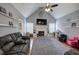 Open living room with vaulted ceilings, fireplace, and large area rug at 20 Friendship Rd, Euharlee, GA 30145