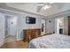 This main bedroom has hardwood floors, tv, tray ceilings, and three doorways at 20 Friendship Rd, Euharlee, GA 30145
