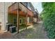 Backyard with wooden deck and tall green hedge at 2774 Birch Grove Se Ln # 11, Marietta, GA 30067