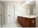 Bathroom with a double sink vanity, tile flooring, and glass enclosed shower at 2774 Birch Grove Se Ln # 11, Marietta, GA 30067
