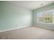 A bright bedroom with a large window that fills the space with natural light, enhancing its spacious feel at 2774 Birch Grove Se Ln # 11, Marietta, GA 30067