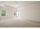 A spacious, bright bedroom with neutral carpeting, white trim, and two large windows that provide ample natural light at 2774 Birch Grove Se Ln # 11, Marietta, GA 30067