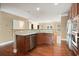 Modern kitchen with granite countertops, stainless steel appliances, and rich wood cabinetry at 2774 Birch Grove Se Ln # 11, Marietta, GA 30067