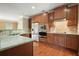 Stylish kitchen featuring granite counters, stainless appliances, and warm wood cabinetry at 2774 Birch Grove Se Ln # 11, Marietta, GA 30067