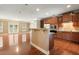 Open kitchen with granite counters, stainless appliances, and a large island overlooking the living area at 2774 Birch Grove Se Ln # 11, Marietta, GA 30067