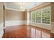 Bright, hardwood-floored living room featuring white trim, and a large window for natural light at 2774 Birch Grove Se Ln # 11, Marietta, GA 30067