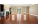 A spacious living room featuring hardwood floors, a cozy fireplace, and direct access to the outdoors through French doors at 2774 Birch Grove Se Ln # 11, Marietta, GA 30067