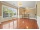 Spacious living room with hardwood floors, a large window, and classic trim accents throughout at 2774 Birch Grove Se Ln # 11, Marietta, GA 30067