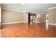 An open-concept living room and kitchen area with hardwood floors and ample natural light throughout the space at 2774 Birch Grove Se Ln # 11, Marietta, GA 30067