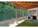 Patio with wooden support beams and green hose at 2774 Birch Grove Se Ln # 11, Marietta, GA 30067