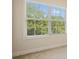 A window with blinds shows green trees and blue sky at 2774 Birch Grove Se Ln # 11, Marietta, GA 30067