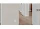 Bedroom featuring neutral walls, carpeted floors, and convenient closet access at 436 Vermeer Ct, Locust Grove, GA 30248