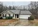 Cozy single-story home with a well-maintained lawn and a two-car garage at 504 Edgewood Trce, Mcdonough, GA 30253
