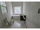 Bathroom featuring a freestanding tub and modern vanity, offering a serene retreat at 854 Mcdonough Se Blvd, Atlanta, GA 30315